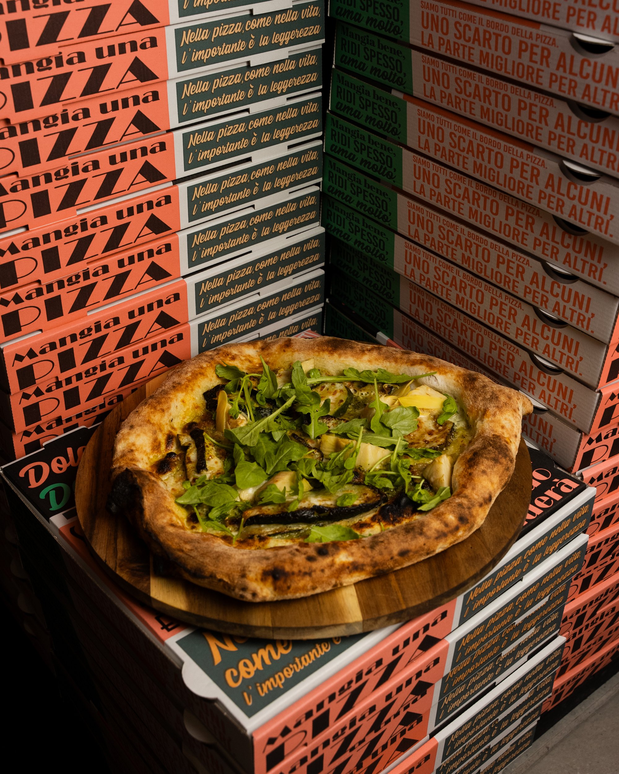 Shooting culinaire Da Luna — assortiment pizzas table partagée